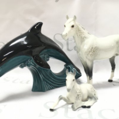 Beswick horses and a Poole dolphin. This lot cannot be posted
