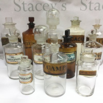 A collection of 12 glass apothecary jars. Shipping category D.