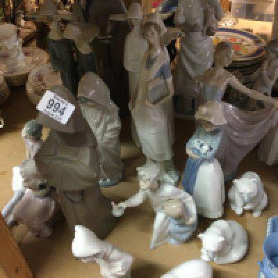 A collection of 16 Lladro figures including dancing figures polar bears.