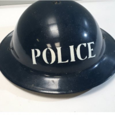 A II world war British steel helmet painted blue Police later decorated.