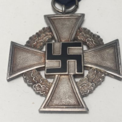 A German Third Reich SS long service medal with black enamel and blur ribbon
