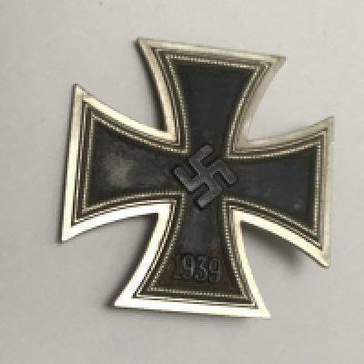 A German Third Reich II world war Iron cross 1939 the pin stamped L15 the badge with authentic wear in keeping with age.