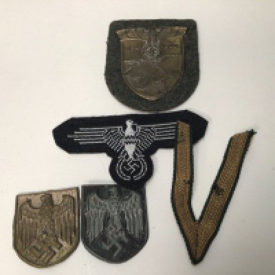 A Russian Front badge Two German Afrika Korps badges and others