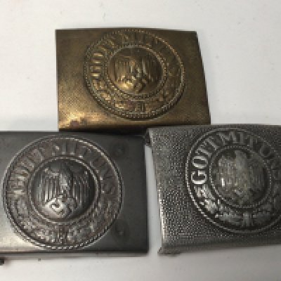 Three German Third Reich Army belt buckles with central Eagle one with a brass finish (3)