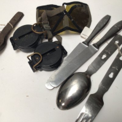 A Collection of German Third Reich military issue cutlery with German marks two compasses and other oddments.