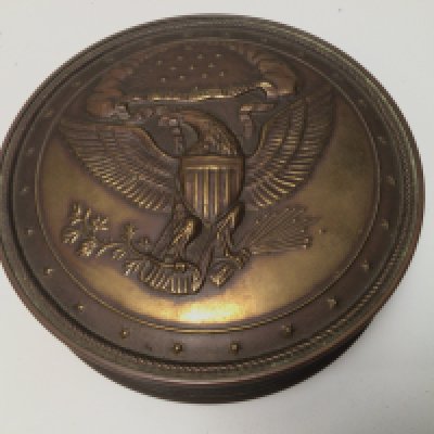 An American brass container of circular shape.