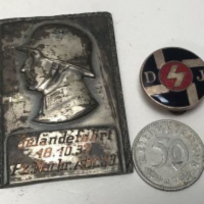 A Rare Early Hitler Movement badge enamel with D J initials a small plaque dated 18.10.37 and a coin (3)
