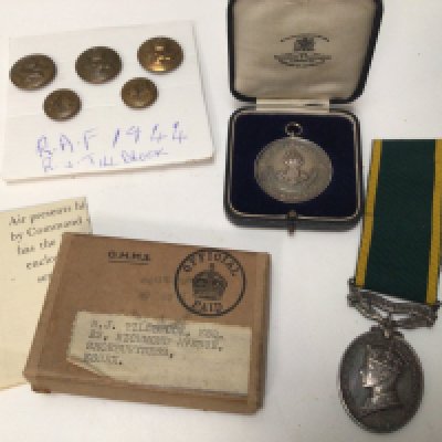 A George VI Territorial efficient service medal Royal Artillery a Royla Engineers medal in a fitted box A war medal awarded to RJ Tillbrook Shoeburyness and a set of buttons