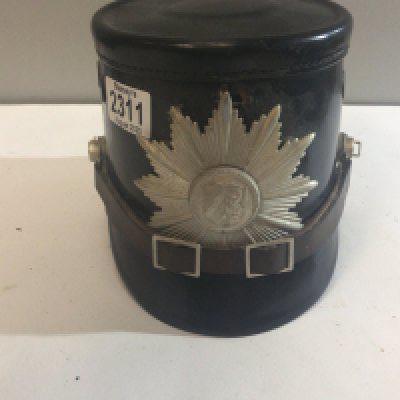 A Continental leather finish helmet with applied badge the interior of the hat with label.