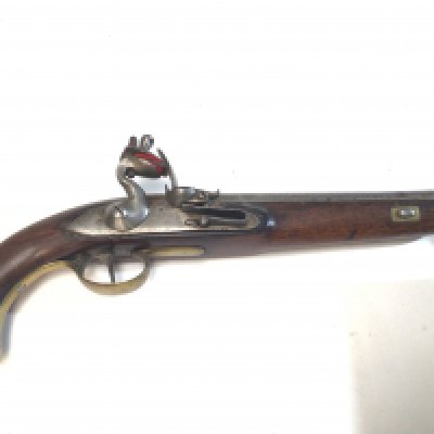 A late 18th Century flintlock pistol possibly military issue the brass fittings with attachment ring steel action and barrel.