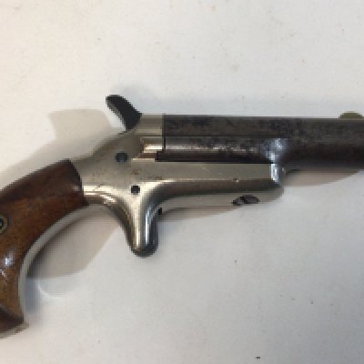 An intresting Belgium made antique pistol,of a .41 caliber colt pistol no visible serial number stamped Colt and with 41 Caliber stamp marks circa 1885, with steel barrel, solid nickel open frame with spur trigger and exposed hammer and smooth walnut birdshead grips.