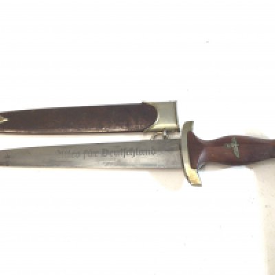 An Early Example German SA dagger 1935 or slightly later issued to the Brown Shirts. The blade with inscription and maker Hugo Rader brown finish. No on the cross guard.