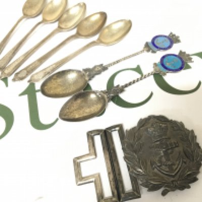 A Silver Royal Navy belt buckle stamped 90 WH with a further mark possible British Chinese Colonial or Honk Kong. Silver and enamel Royal Navy spoons and other silver spoons.