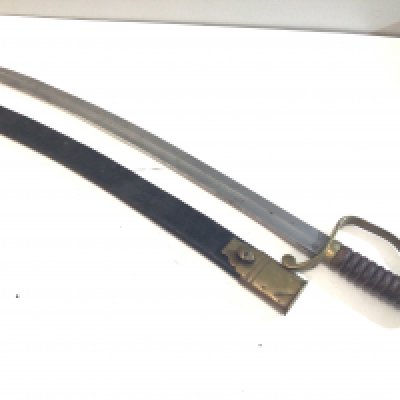 A Victorian Police officer sword with a wood grip brass cross guard numberer 273