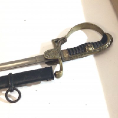 A German Third Reich Military officers dress sword with dove head ornate brass Guard makers stamp to the blade