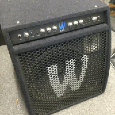 A Warwick CCL 250W 1x15" bass guitar combo amplifier with cover, user manual and power lead.