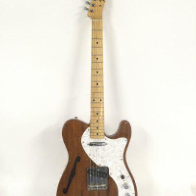A Japanese Fender Telecaster Thinline electric guitar with hard carry case.