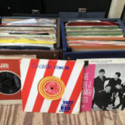 Seven record cases of 7" singles and EPs by various artists including Gene a Vincent, The Who, Little Richard and many more.