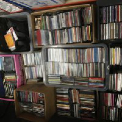 A large collection of CDs and audio cassettes, various artists.