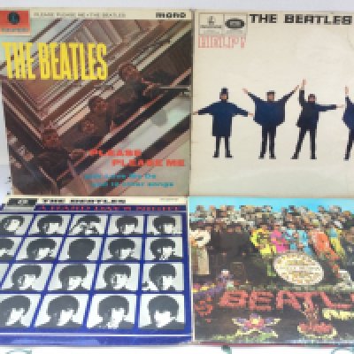Four early UK pressings of Beatles LPs including 'Please Please Me' (not black and gold label), 'Sgt Peppers' (no cut outs included) and others.