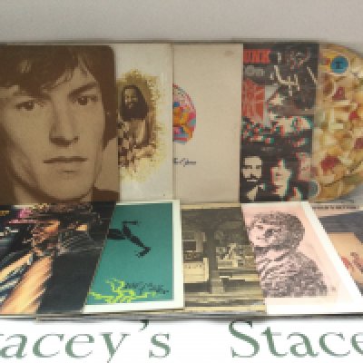 A collection of over 30 rock and pop LPs by various artists including Queen, Tom Waits, Grand Funk Railroad, Spirit and others.