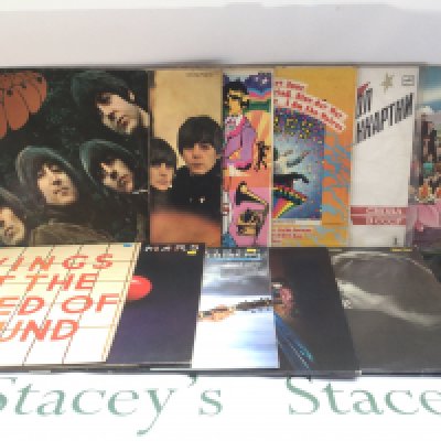 Twelve Beatles and solo LPs comprising 'Rubber Soul', a US Capitol pressing of 'Magical Mystery Tour', 'Dark Horse' and others.