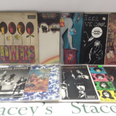 Two bags containing 20 Rolling Stones and solo LPs, EPs and a 10" disc comprising a lenticular sleeve 'Their Satanic Majesties Request', 'Some Girls', 'Primitive Cool' and others.