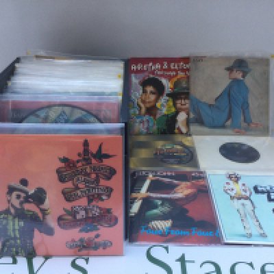 A record case of Elton John 7" singles and EPs.
