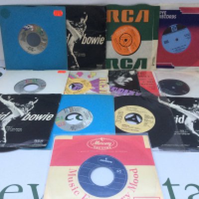 A collection of David Bowie 7" singles and EPs comprising a collectable 'Holy Holy' b/w 'Black Country Rock', a 1972 EP of early releases including 'I Dig Everything', various promo discs etc.