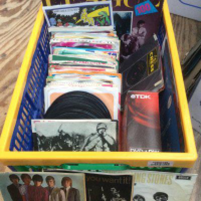 A box of 7" singles, EPs and LPs by various artists including The Rolling Stones, Traffic, Muddy Waters and others.
