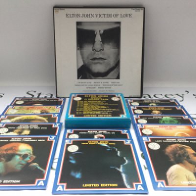 An Elton John 'Victim Of Love' 4LP promo pack and a limited edition 7" singles pack (2).
