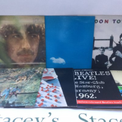 Fifteen Beatles and related LPs and 12" singles comprising a red vinyl '1962-1966', 'McCartney', a promo copy of 'London Town' and others.