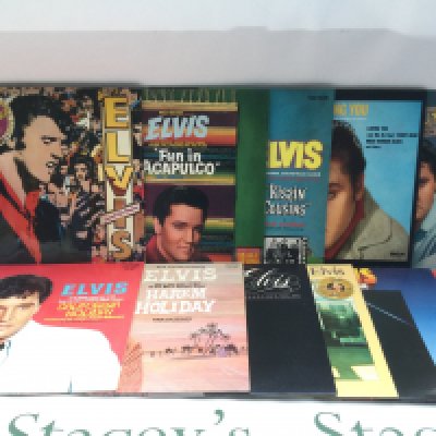 Two bags containing 23 Elvis Presley LPs including 'Moody Blue', 'Harem Holiday' and others. Includes two promo LPs.