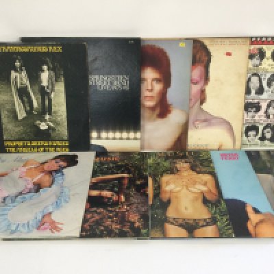 Two bags containing 20 LPs by various artists including David Bowie, Tyrannosaurus Rex, Roxy Music, The Rolling Stones and others.