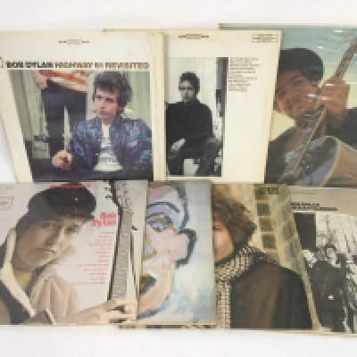 Two bags containing 15 Bob Dylan LPs comprising 'Blonde On Blonde', 'Nashville Skyline', 'Highway 61 Revisited' and others