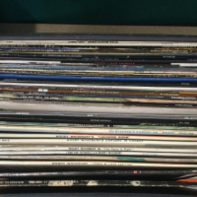 Eight record cases of LPs by various artists including The Small Faces, Bruce Springsteen, Elvis Presley and others.