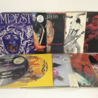 Two bags containing 20 rock LPs and 12" singles by various artists including Bad Company, Meat Loaf, Motley Crue and others