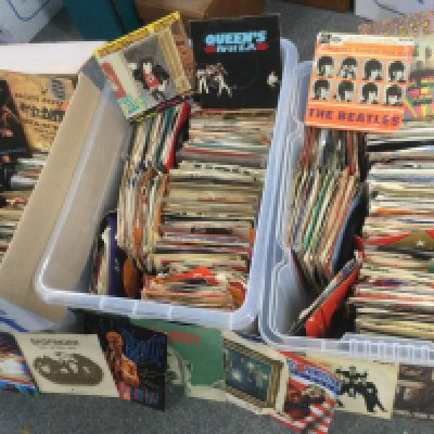 Three boxes. Of 7" singles and EPs by various artists including David Bowie The Beatles, Sex Pistols, AC/DC and many more.