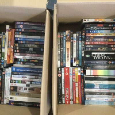 Four boxes of DVDs, BluRays and CDs.
