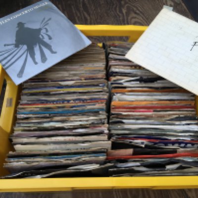 Two boxes of 12" and 7" singles by various artists including Queen, Elton John, John Lennon and others.