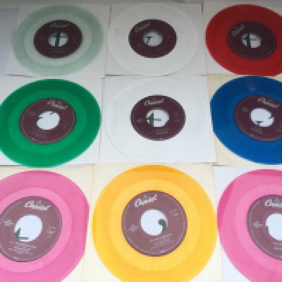 A collection of 29 Beatles 7" jukebox singles on coloured vinyl and on the Capitol label.