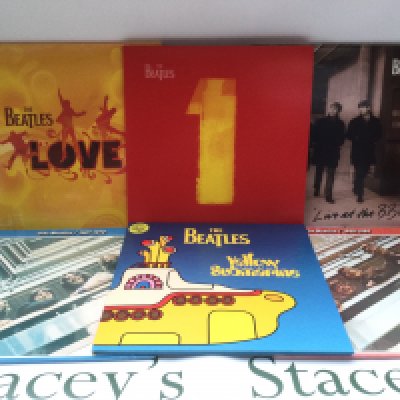Six Beatles LPs comprising a sealed 'Love' album, 'Live At The BBC', '1' and others.