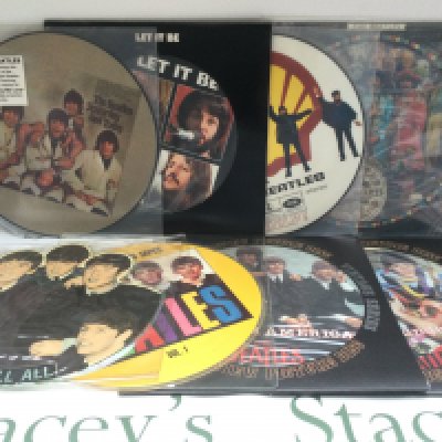 A collection of Beatles picture discs including 'Sgt Pepper', 'Let It Be', 'Yesterday And Today' and others.