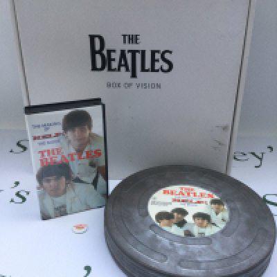 An unopened Beatles Box Of Vision CD storage box and The Making Of Help! VHS housed in a film reel can (2).