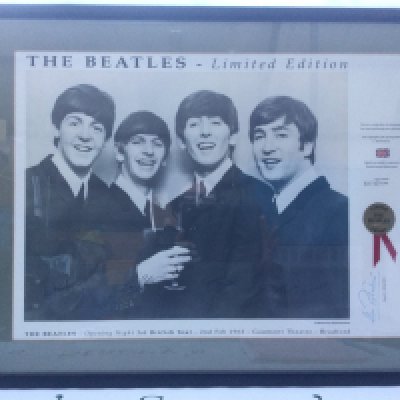 Four framed prints of The Beatles including limited editions.