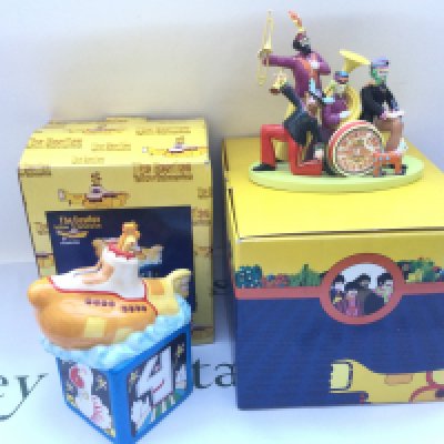 Two boxed Yellow Submarine ceramic items comprising a limited edition Coalport Sgt Pepper's band figural group and a money box (2).