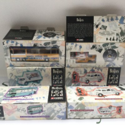 Six boxed Corgi Classics Beatles related vehicles.