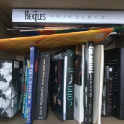 Four boxes of Beatles related hardback books including 'Many Years From Now', 'Anthology' and many more plus some calendars and newspapers.