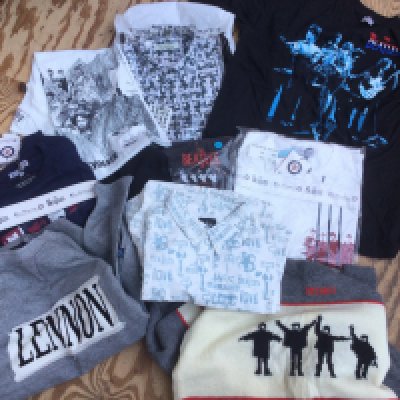 A collection of Beatles related clothing including Ben Sherman examples.