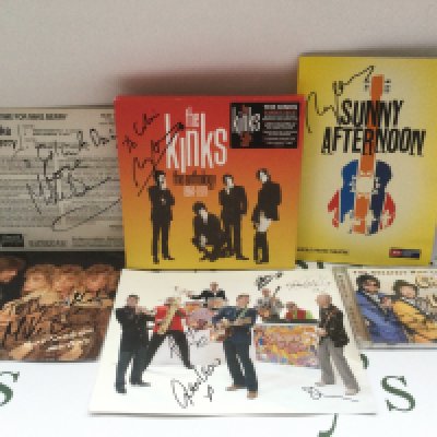 A collection of signed items including a Kinks 5CD box set signed by Ray Davies, a Chas & Dave CD, two Mike Berry records and other items including two Bruce Springsteen tickets (unsigned).